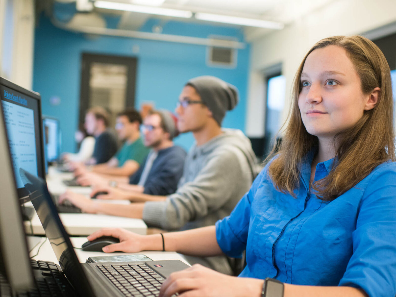 student confidently working on computer