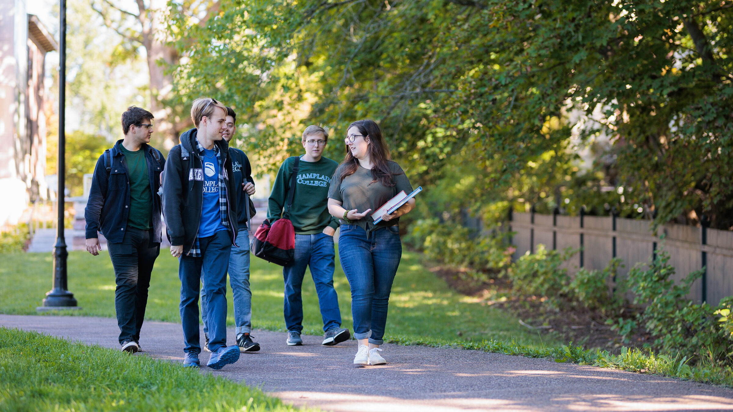 students walking along sidewalk to class