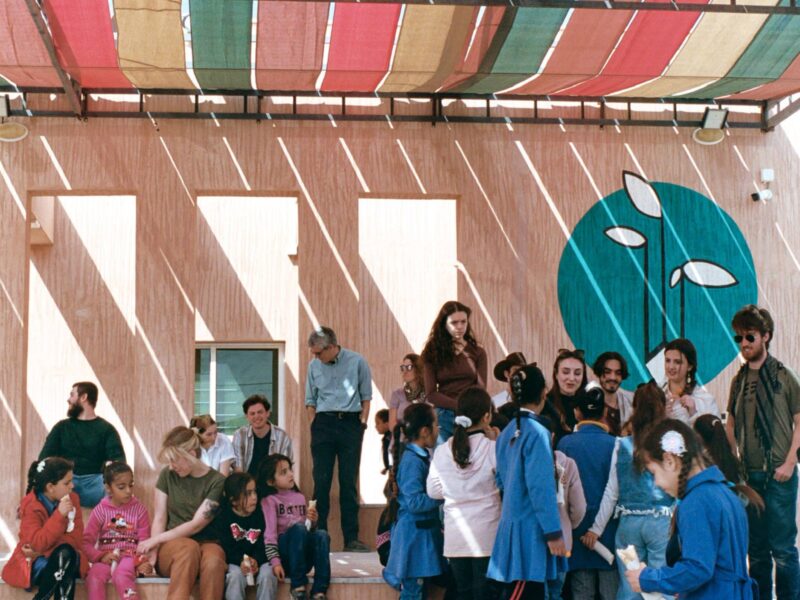 a group of people and children outside