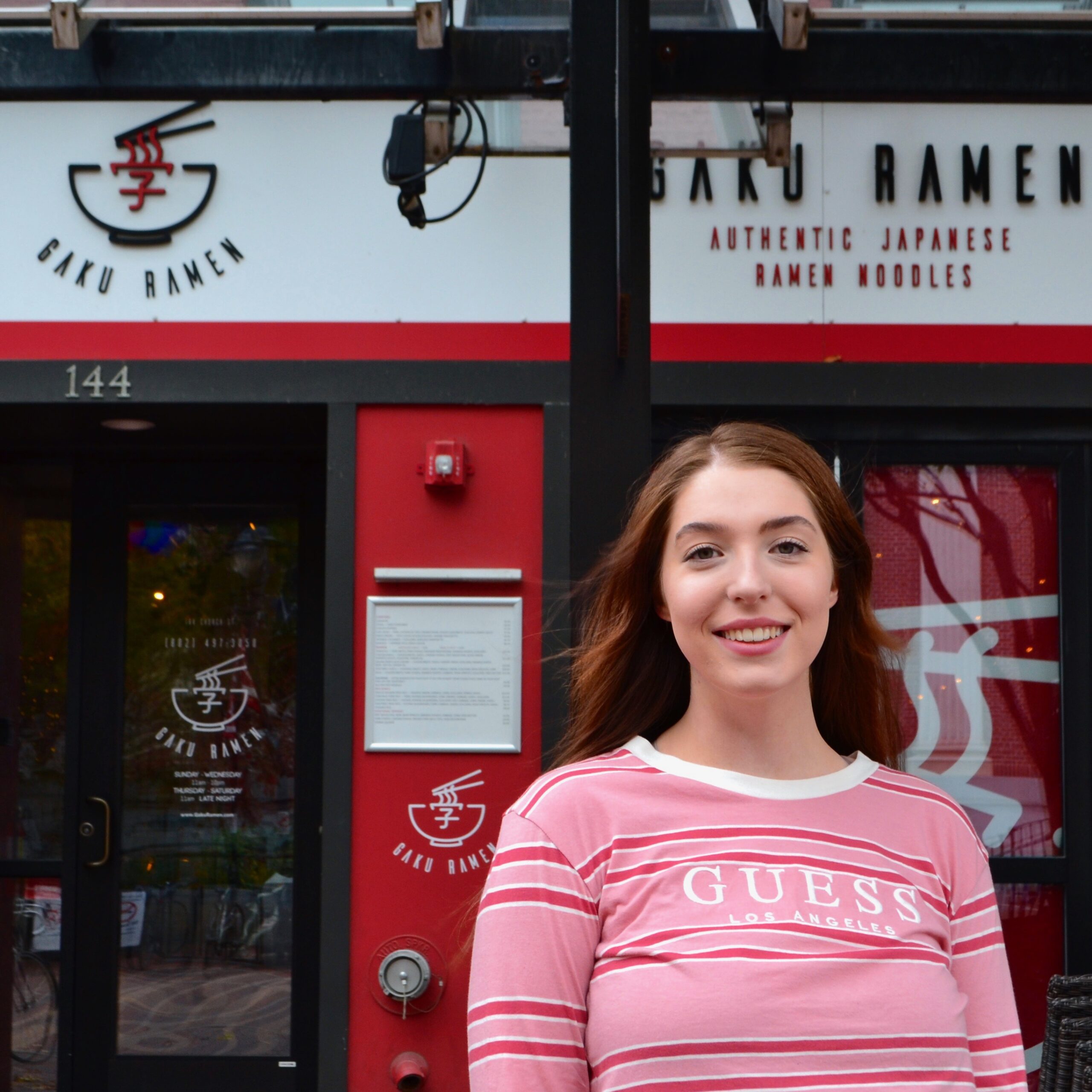Sydney Broadbent standing outside of Gaku Ramen