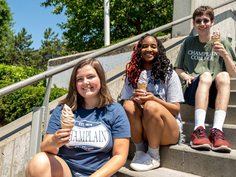 Students having creemees on steps outside